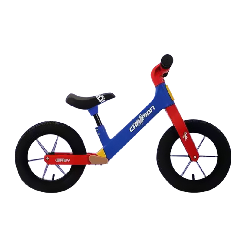 Toddler riding a balance bike in the park
